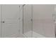 Luxurious shower with frameless glass door and elegant marble-style tile surround at 23443 W Albeniz Pl, Buckeye, AZ 85326