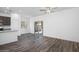 Spacious living room with wood flooring and sliding glass doors to the backyard at 24571 W St Anne Ave, Buckeye, AZ 85326