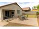 Expansive backyard with patio and table set, great for outdoor entertaining at 25028 W Wayland Dr, Buckeye, AZ 85326
