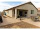Expansive backyard with patio and table set, great for outdoor entertaining at 25028 W Wayland Dr, Buckeye, AZ 85326