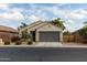 Charming single-story home with a well-maintained front yard and a two-car garage at 25028 W Wayland Dr, Buckeye, AZ 85326