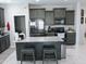 Modern kitchen with granite countertops, stainless steel appliances, and ample cabinet space at 25028 W Wayland Dr, Buckeye, AZ 85326