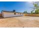 Home backyard featuring fresh fence, clear dirt pad, and home's exterior at 2540 E Hartford Ave, Phoenix, AZ 85032
