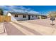 A single-story home featuring a concrete driveway and low-maintenance landscaping at 2540 E Hartford Ave, Phoenix, AZ 85032