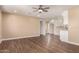 An open-concept living space with wood floors and a ceiling fan at 2540 E Hartford Ave, Phoenix, AZ 85032