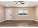 Well-lit living room featuring wood-look floors, recessed lights, and a new door at 2540 E Hartford Ave, Phoenix, AZ 85032