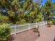 Charming backyard featuring a white picket fence and views to a patio with a fountain feature at 25829 S Mandarin Dr, Queen Creek, AZ 85142