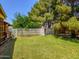 The backyard has lush greenery, grass, and fencing for privacy at 25829 S Mandarin Dr, Queen Creek, AZ 85142