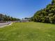 Expansive lawn and mature trees enclose the backyard at 25829 S Mandarin Dr, Queen Creek, AZ 85142