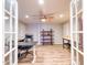 Finished basement featuring an office and additional work space with wood laminate flooring at 25829 S Mandarin Dr, Queen Creek, AZ 85142