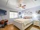 Cozy bedroom with a plush bed, decorative pillows, and a ceiling fan for ultimate relaxation and comfort at 25829 S Mandarin Dr, Queen Creek, AZ 85142