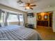This bedroom has a big bright bay window, large television, and an ensuite bathroom at 25829 S Mandarin Dr, Queen Creek, AZ 85142