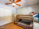 Bedroom featuring a bunk bed, neutral paint, ceiling fan and a sliding door closet at 25829 S Mandarin Dr, Queen Creek, AZ 85142