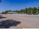 A long driveway and white fence lead to this beautiful ranch style home at 25829 S Mandarin Dr, Queen Creek, AZ 85142