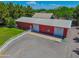 Large red barn with multiple bays and a white fence for a rural feel at 25829 S Mandarin Dr, Queen Creek, AZ 85142