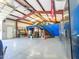 Interior view of the garage, featuring steel beam construction, a ceiling fan and epoxy flooring at 25829 S Mandarin Dr, Queen Creek, AZ 85142