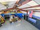 Overhead interior view of garage, featuring epoxy flooring, overhead storage and ample cabinet space at 25829 S Mandarin Dr, Queen Creek, AZ 85142