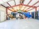 Interior view of the garage, featuring steel beam construction, a ceiling fan and epoxy flooring at 25829 S Mandarin Dr, Queen Creek, AZ 85142