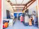 Spacious garage with metal beam construction used for shop or storage with tools and equipment at 25829 S Mandarin Dr, Queen Creek, AZ 85142