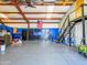 Interior view of garage, featuring epoxy flooring, overhead storage and ample cabinet space at 25829 S Mandarin Dr, Queen Creek, AZ 85142