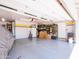 Organized garage with storage shelves, painted floor, and ample space for storage and vehicles at 25829 S Mandarin Dr, Queen Creek, AZ 85142