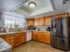 Cozy kitchen featuring wood cabinets, stainless steel appliances, and ample counter space at 25829 S Mandarin Dr, Queen Creek, AZ 85142