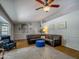 Comfortable living room with a large sofa, stylish rug, and bright natural light at 25829 S Mandarin Dr, Queen Creek, AZ 85142