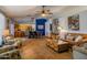 Spacious living room featuring tile floors and an open layout to the dining area at 25829 S Mandarin Dr, Queen Creek, AZ 85142