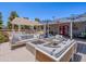 Spacious outdoor living area with fire pit, stylish seating, and a covered pergola, ideal for entertaining and relaxation at 25829 S Mandarin Dr, Queen Creek, AZ 85142
