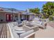 Inviting outdoor living area featuring comfortable seating, a fire pit, and colorful umbrellas for shade and style at 25829 S Mandarin Dr, Queen Creek, AZ 85142