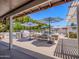 Inviting patio area featuring outdoor seating, umbrellas, and a grill, perfect for entertaining at 25829 S Mandarin Dr, Queen Creek, AZ 85142