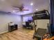 Office featuring hard wood floors, a ceiling fan, natural lighting, and workout equipment at 25829 S Mandarin Dr, Queen Creek, AZ 85142