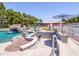 Swimming pool with waterfall feature and comfortable poolside seating, perfect for enjoying sunny days and relaxation at 25829 S Mandarin Dr, Queen Creek, AZ 85142