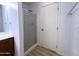 Bathroom featuring a shower with glass doors at 272 S 228Th Ln, Buckeye, AZ 85326