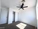 Bedroom with neutral walls, ceiling fan, and closet at 272 S 228Th Ln, Buckeye, AZ 85326