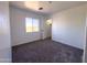 Neutral bedroom featuring carpet and natural light at 272 S 228Th Ln, Buckeye, AZ 85326