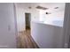Open hallway with wood flooring leading to the bathroom at 272 S 228Th Ln, Buckeye, AZ 85326