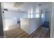 Bright hallway with white walls and wood-style floors at 272 S 228Th Ln, Buckeye, AZ 85326