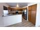 Kitchen featuring stainless steel appliances and wood cabinetry at 272 S 228Th Ln, Buckeye, AZ 85326
