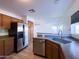 Kitchen featuring stainless steel appliances and wood cabinetry at 272 S 228Th Ln, Buckeye, AZ 85326