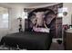 A spacious bedroom with an elephant tapestry and comfortable bed, creating a tranquil retreat at 2723 W Apollo Rd, Phoenix, AZ 85041