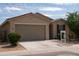 Attractive one-story house with a roomy garage, neat front garden, and a traditional tiled roof at 2723 W Apollo Rd, Phoenix, AZ 85041