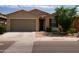 Charming single-story home with a two-car garage, desert landscaping, and a tile roof, perfect for low-maintenance living at 2723 W Apollo Rd, Phoenix, AZ 85041