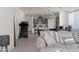 Open-concept living space with a view into the kitchen and stylish, comfortable seating at 2723 W Apollo Rd, Phoenix, AZ 85041