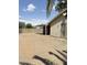 View of the backyard featuring gravel surface, a covered patio, and block wall at 2937 E Garnet Cir, Mesa, AZ 85204