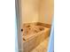 Bathroom featuring a tile-lined soaking tub at 2937 E Garnet Cir, Mesa, AZ 85204