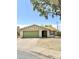 Charming single-story home featuring a well-kept front yard and a spacious two-car garage at 2937 E Garnet Cir, Mesa, AZ 85204
