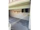 View of the garage interior, featuring drywall, shelving, and a concrete floor at 2937 E Garnet Cir, Mesa, AZ 85204