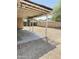 This backyard covered patio features concrete flooring and a gravel surface surrounding the area at 2937 E Garnet Cir, Mesa, AZ 85204