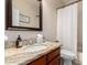 Bright bathroom features a granite countertop, large mirror, and a shower with a curtain at 3581 W Ironwood Dr, Chandler, AZ 85226
